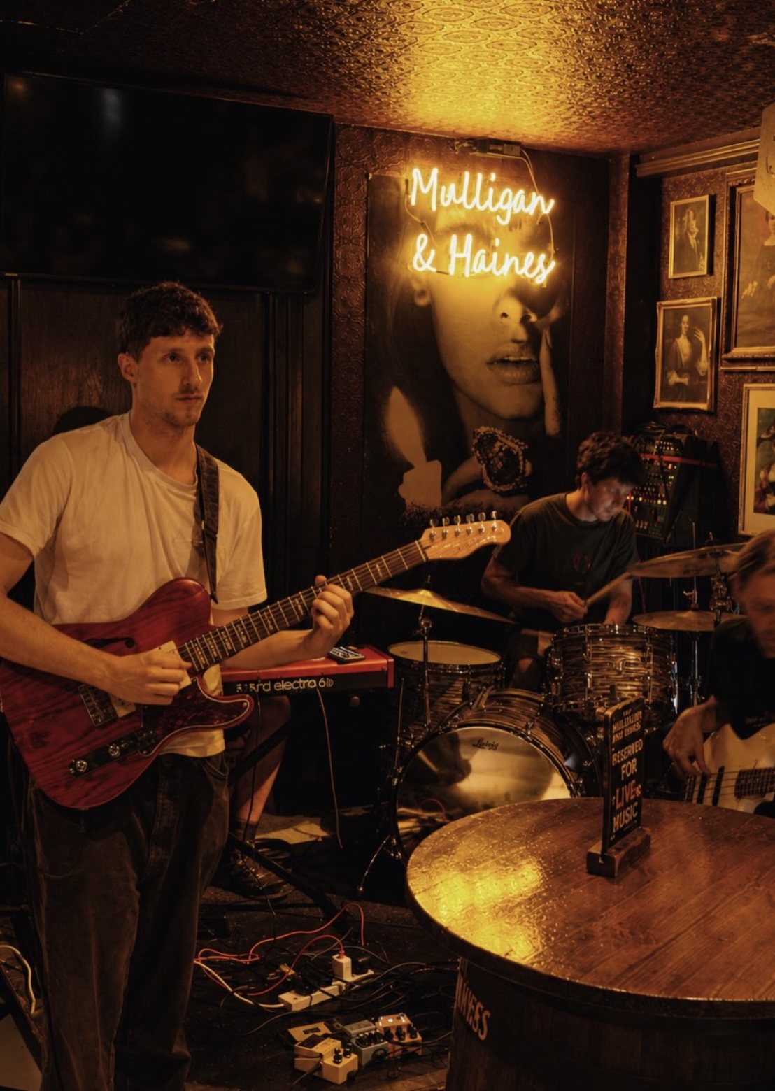 A singer and guitarist performing live in Mulligan House