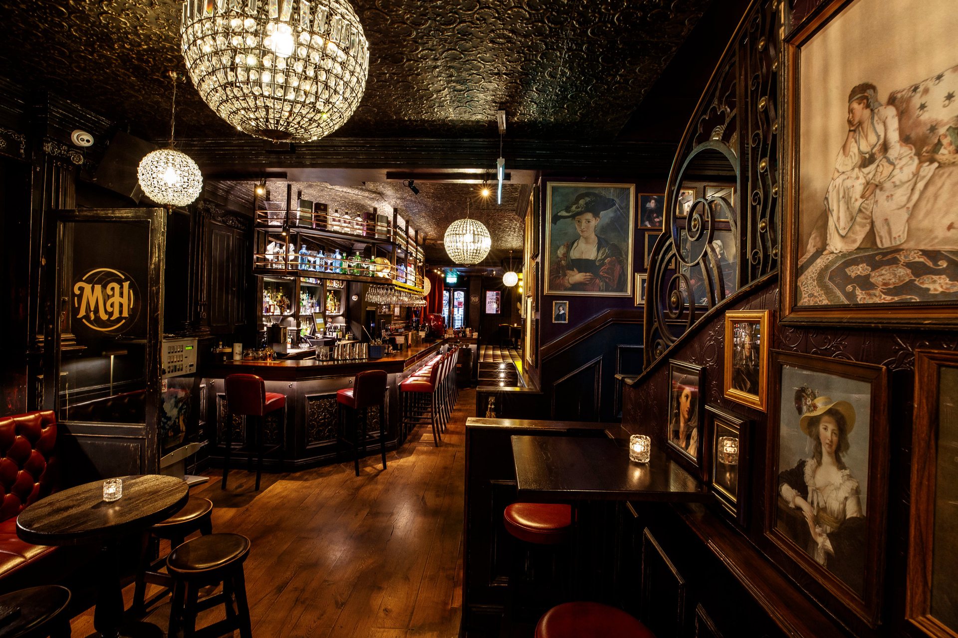 Dark wood, warm globe lighting and the long bar at 32 Dame Street